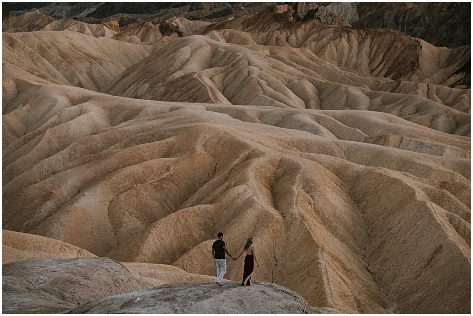 A couple at Zabriskie Point above the Death Valley badlands